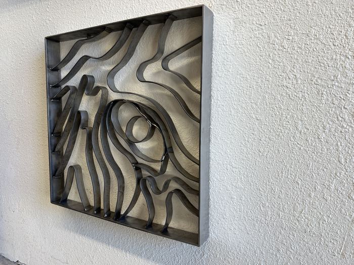 Topograin wall art from the side, showing the depth of the frame and its shadows